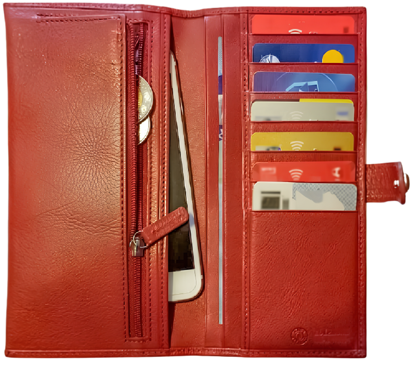 Open red Alma leather wallet showing card slots, coins in a zipped compartment, and a phone tucked into an inner pocket.