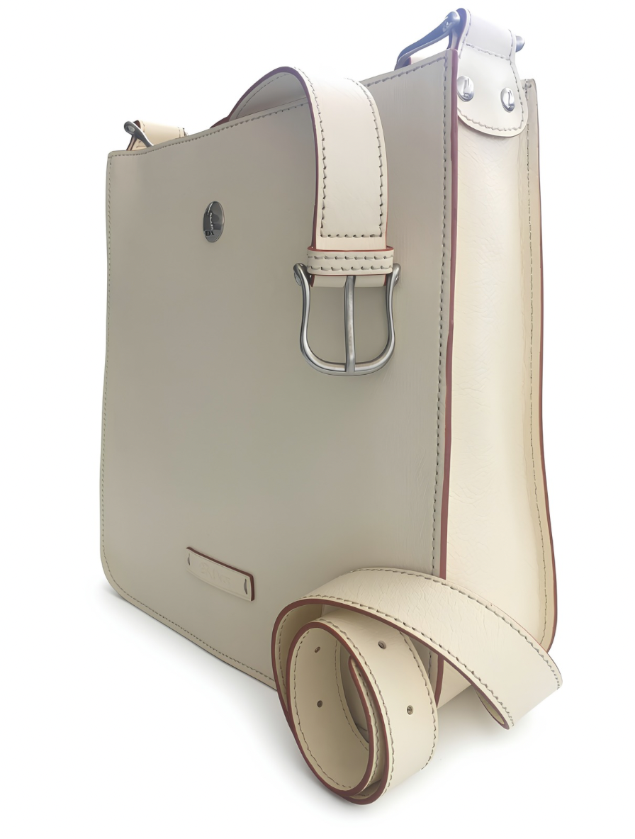 Ivory Emilio/Emilia leather shoulder bag viewed at an angle, showing side depth, metal strap buckle, riveted attachment, contrast stitching, and a coiled adjustable strap.